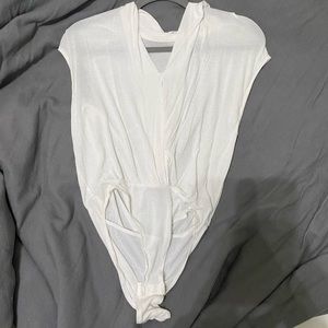 White body suit. Looks weird in picture but is super cute on.